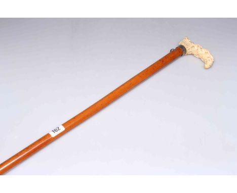 Walking stick with carved handle