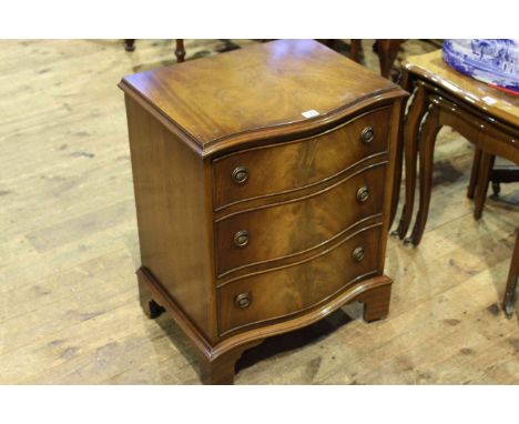 Mahogany serpentine front chest of three drawers on bracket feet