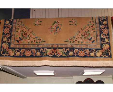 Chinese carpet with a mustard and floral ground 3.80 x 2.80