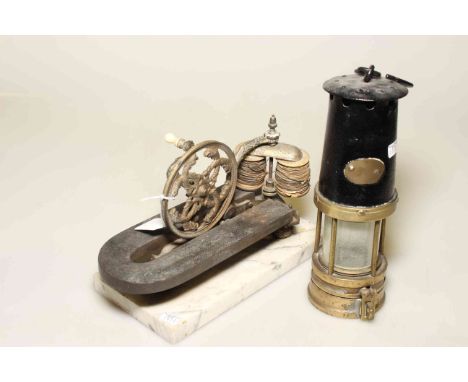 Miners lamp and a spinning wheel