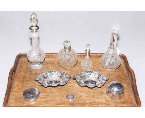 Pair of pierced silver dishes, five silver topped toilet bottles, Oriental compact and pill box