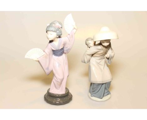 Two Lladro young Oriental ladies, one with fans, the other a baby