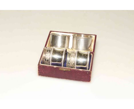 Two pairs of silver napkin rings and a pair of plated napkin rings (6)