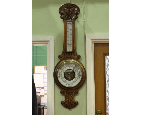 Carved oak aneroid banjo barometer with enamelled dial