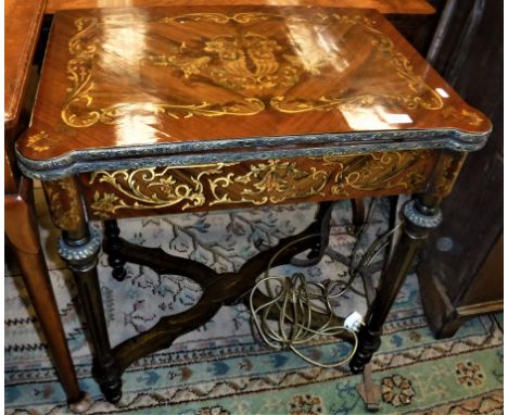 A modern Continental walnut and marquetry inlaid fold-over card table in the 19th Century French manner, raised on turned and