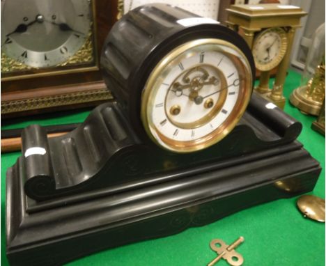 A late Victorian black marble cased mantel clock, the eight day movement by "L B" with white enamelled dial and visible escap