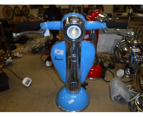 A pale blue painted and polished metal "Vespa" table lamp