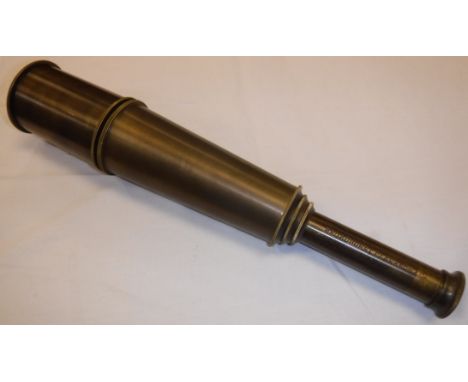 A modern reproduction brass four draw telescope inscribed "Broadhurst Clarkson &amp; Co. London 1942"