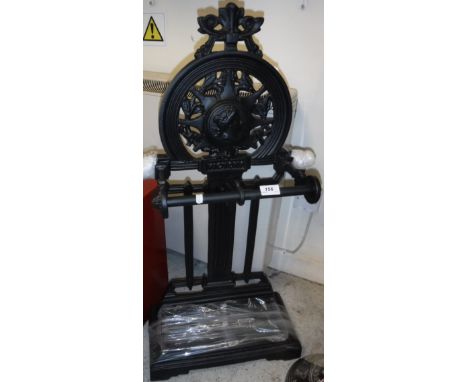 A black painted cast metal stick stand in the Victorian manner, inscribed "Victory"  Size approx. 88cm high x 43cm wide