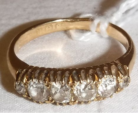 An 18 carat gold five stone diamond set ring, size P, total weight 3.7 g, approx 0.6 carat total 