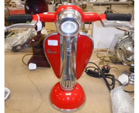 A red painted and polished metal "Vespa" table lamp