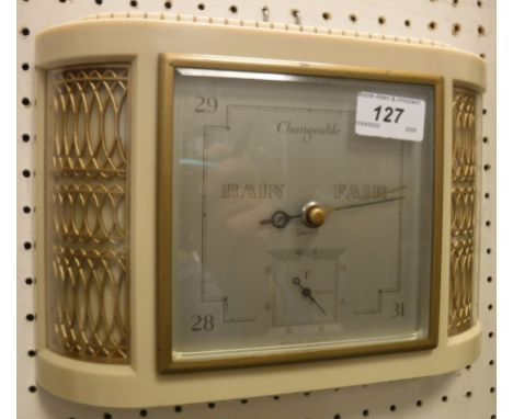 A Smith's wall barometer in white plastic and gilded bow fronted case in the Art Deco taste, with silvered dial  Size approx 