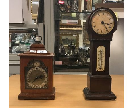 An oak mantel clock with English movement, the brass dial set with Roman numerals, together with an early 20th Century mahoga