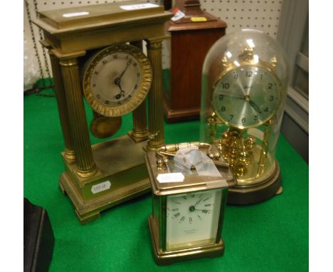 A 19th Century French mantel clock of architectural form with four fluted columns the drum case with silvered dial and Roman 