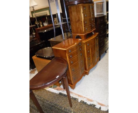 A mahogany bow fronted chest of six drawers, three modern yew wood serpentine fronted chests, a pair of David Rogers mahogany