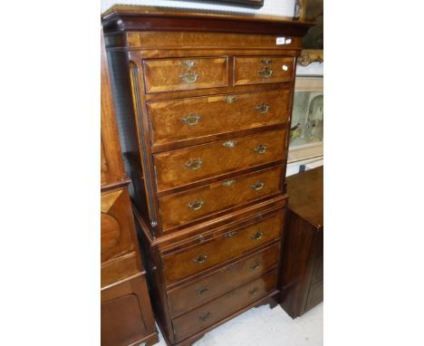 A modern burr walnut and cross-banded chest on chest, the upper section with two short over three long drawers over a brushin