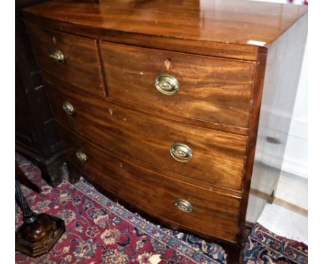 An early 19th Century mahogany bow fronted chest of two long graduated drawers on splayed bracket feet  size approx. 102cm lo