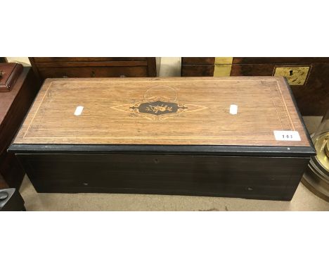 A 19th Century Swiss rosewood and marquetry inlaid cased musical box with eight airs, bearing label inscribed "ER McCoy Xmas 