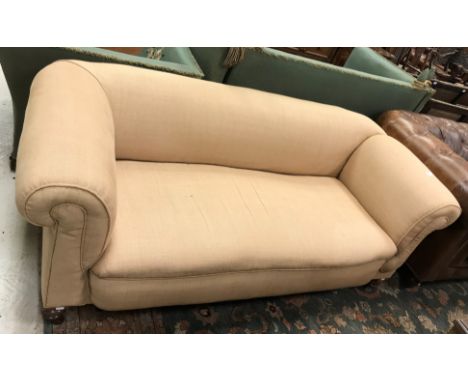 A circa 1900 upholstered Chesterfield drop arm sofa on turned legs to castors  Size 180cm long x 68cm high x 80cm deep CONDIT