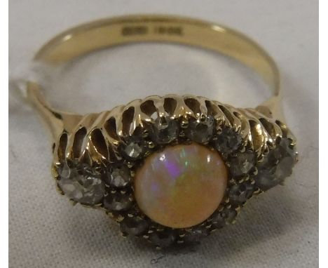 An 18 carat gold opal and diamond set ring, size P, total weight approx 4.9 g CONDITION REPORTS Other than slight surface scr