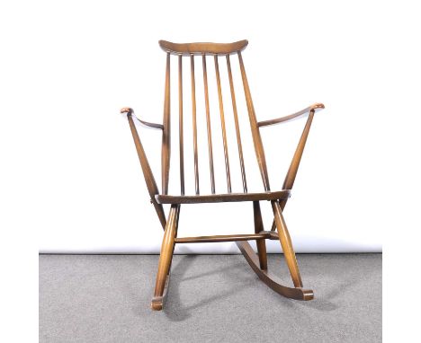 Ercol rocking chair, Golden Dawn staining, applied label and stamped marks, depth 71cm, width 62cm, height 86cm.Condition rep