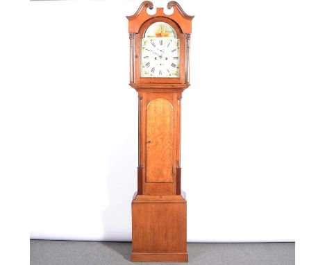 Oak longcase clock, the hood with swan neck pediment, turned columns, the trunk with arched door, plinth base, 12" arched pai