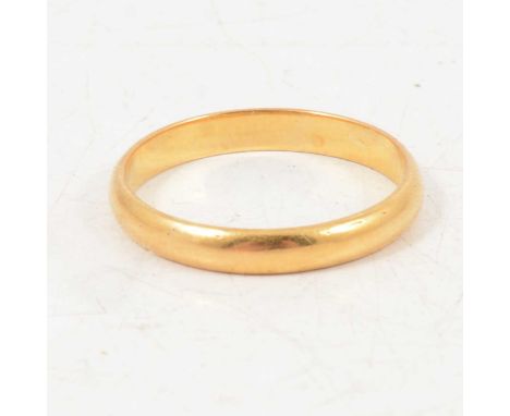 A 22 carat yellow gold wedding band, 2.9mm wide D-shape plain polished band, ring size O, 2.7g.