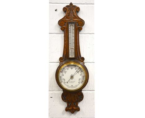 An oak cased aneroid banjo barometer/thermometer, signed R T Vaux &amp; Son, Sunderland, 87cm.