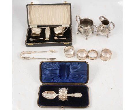 Silver three-piece cruet, tongs, napkin rings, silver plated cream jug and sugar bowl, etc.Condition report:Four silver napki