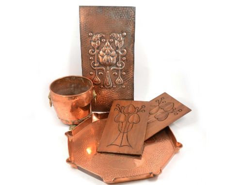 Pair of Art Nouveau style wooden panels, floral decoration, 33x18.5cm, embossed copper panel, leaf shaped tray and a copper p