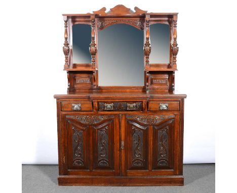 Late Victorian walnut mirror-back sideboard, shaped top, the back with three mirror panels, breakfront base with carved drawe