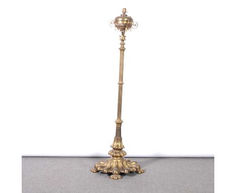 Victorian brass standard lamp, reeded column, fluted base on four feet, converted to electrcity, 150cm.Condition report:There