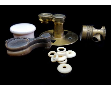 Scientific Instruments - Three jewellers magnifying lenses in horn hounts; a microscope lens in paper box; a magnifying lens 