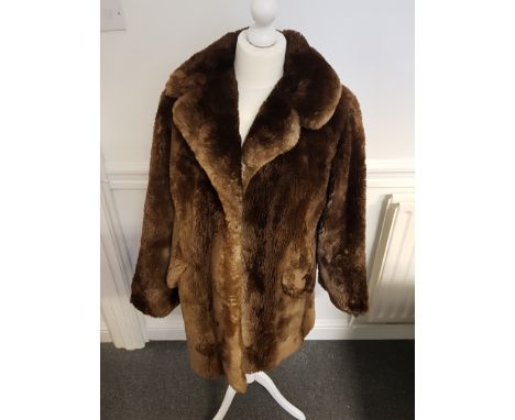 A Marshall and Snelgrove fur coat; and one other (2)