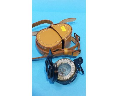 A Military compass in a leather case