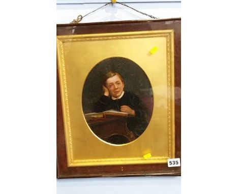 Oval portrait of a school boy within a rosewood frame, 23 x 18cm