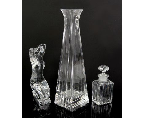 Baccarat, a glass model of a seated nude lady,  etched mark to base, 16cm high, together with a Baccarat  perfume bottle and 