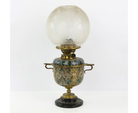 Doulton Lambeth stoneware Oil lamp with brass mounts, circular engraved glass shade , on circular step base support. dated 18
