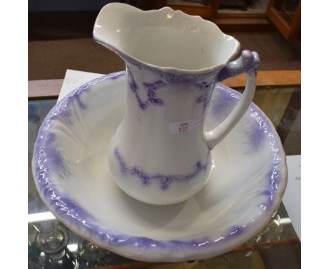 Late 19th century jug and wash basin decorated in tones of purple, jug 25cm high   