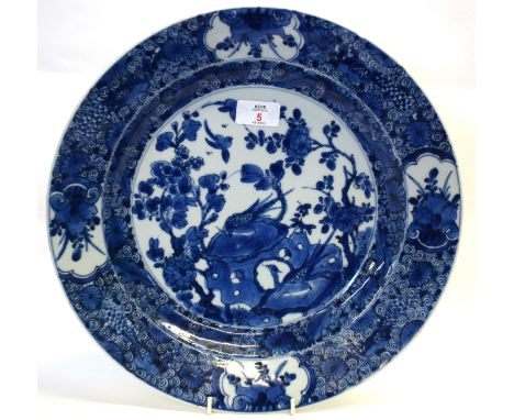 18th century Chinese porcelain charger probably Kangxi period, decorated in under glaze blue with scroll work at the centre, 