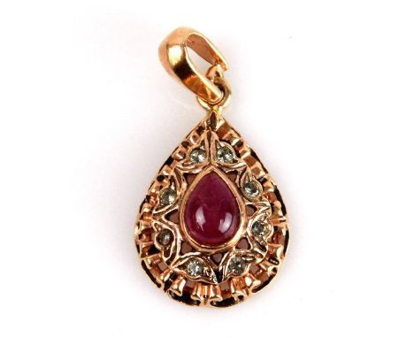 Italian 14k Rose Gold Ruby and Diamonds Pendant. Of tear shape set with 8 old cut diamonds in total weight of 0.25ct. the cen