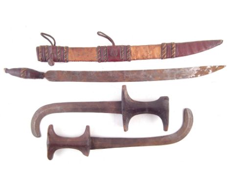 Two African Beja daggers , with curved double edged blades, also another dagger with patterned leather scabbard, (3) The larg