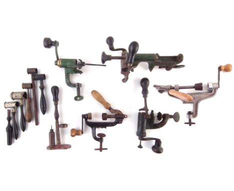 A collection of shotgun reloading tools, including five table clamp reloading presses two marked 12, one 11 and one 18bore, o