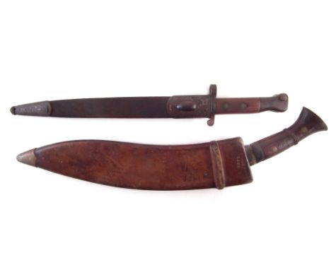 WW1 era Kukri / Gurkha knife and scabbard , the blade stamped G.D&amp;Co. 1918, the scabbard with broad arrow mark, 1917 date