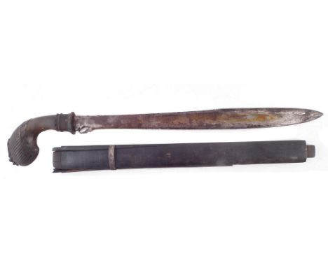 Malayan Bade-Bade, with scrolling carved horn grip, shaped blade, with remnants of scabbard, 59cm overall length