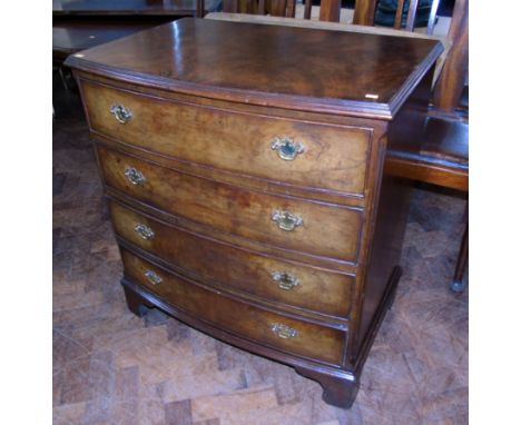 20th century burr walnut veneered bow fronted chest of drawersCondition reports are not available for the Interiors Sale.