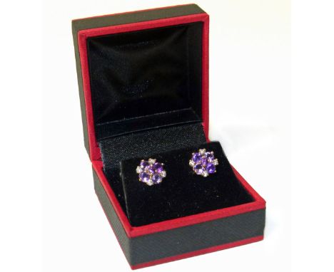 Pair of Amethyst and diamond floral cluster 9ct Gold stud earingsCondition reports are not available for the Interiors Sale.