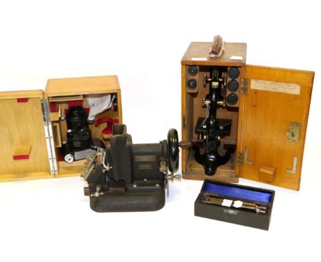 Watson Microscope with three lens turret, black lacquered, in original case; together with a Watson Microscope camera and a R