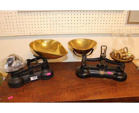 Libra Scale Co Cast Iron kitchen scales with bell weights and a similar Scales 