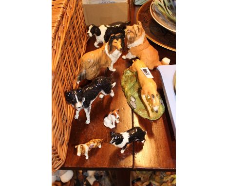 Collection of assorted Ceramic dog figures inc. Royal Doulton, Beswick etc 